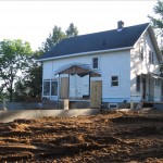 Exterior View, poured and backfilled foundation
